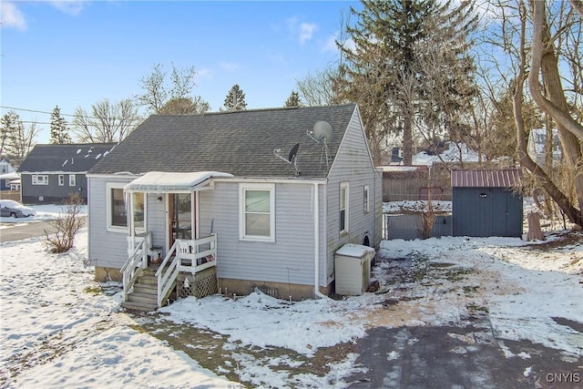 view of front of home with a storage unit