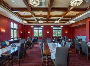 dining space with ornamental molding, coffered ceiling, dark carpet, beam ceiling, and french doors