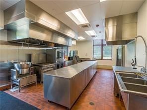 kitchen with ventilation hood and a kitchen island