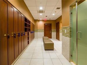 interior space with mail boxes, a paneled ceiling, and light tile patterned floors