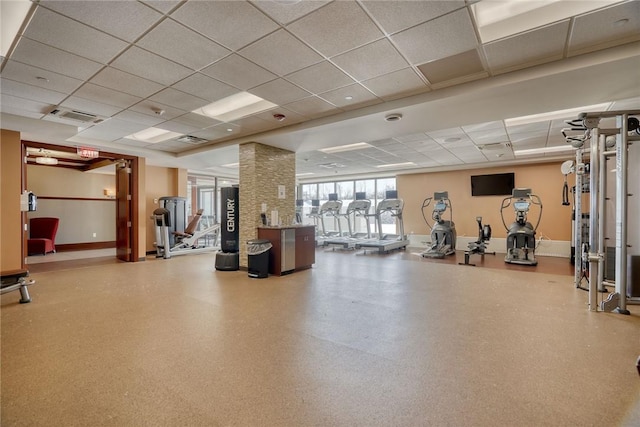 workout area with a paneled ceiling