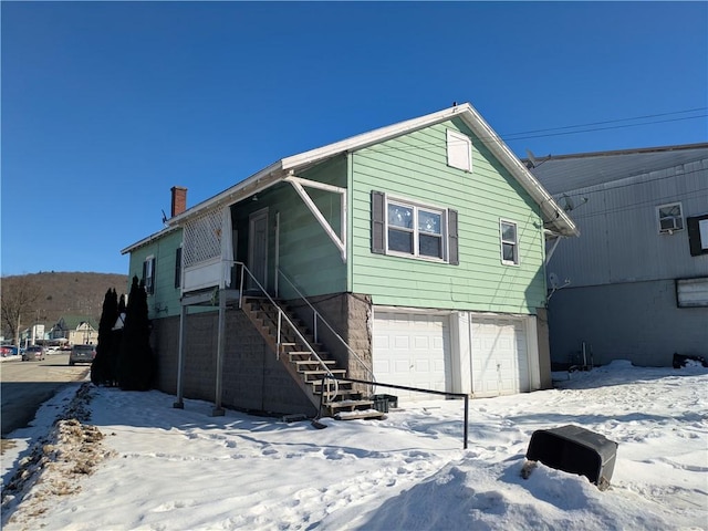 12 N Kendall Ave Unit 12, Bradford-City, PA 16701 - snow covered house with a garage