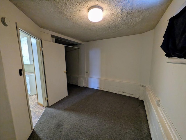 unfurnished bedroom with a textured ceiling