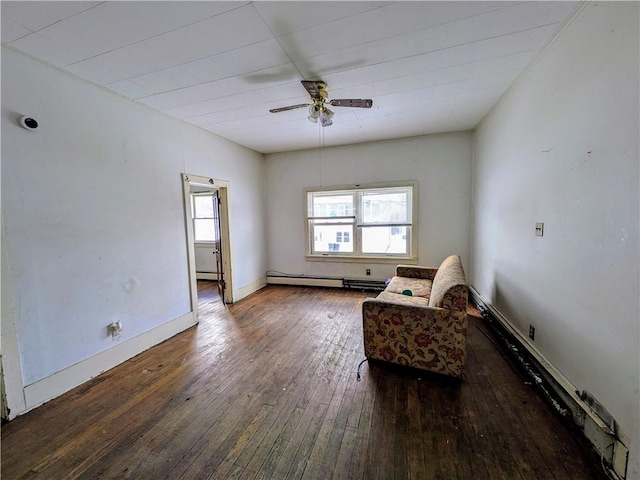 living area with wood-type flooring, ceiling fan, and baseboard heating