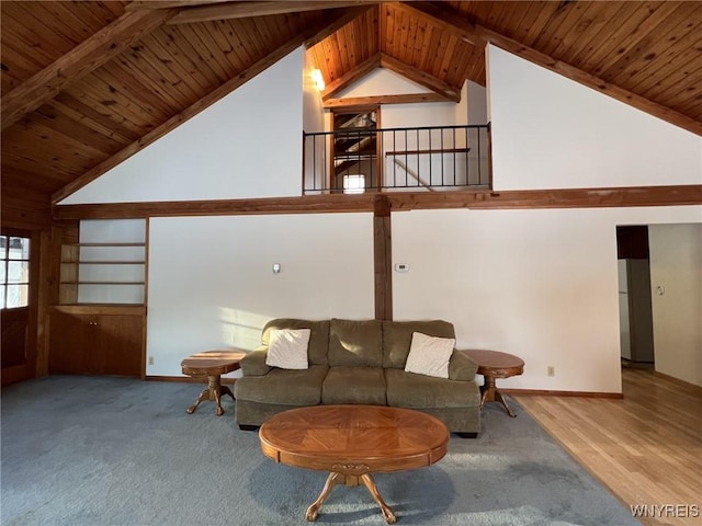 living room featuring lofted ceiling, carpet, and wood ceiling