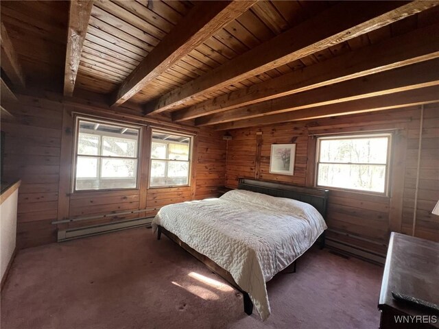 bedroom featuring wood walls, wooden ceiling, a baseboard radiator, dark carpet, and beam ceiling