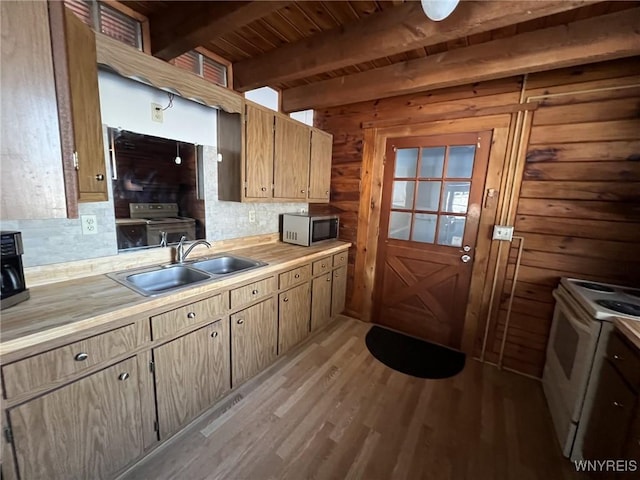 kitchen with beamed ceiling, sink, wood ceiling, white range with electric cooktop, and light hardwood / wood-style flooring