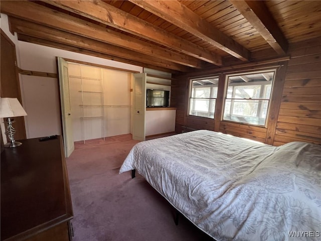 bedroom featuring wooden ceiling, beam ceiling, and wooden walls