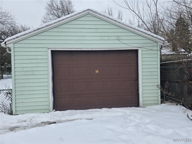 view of snow covered garage