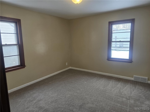 empty room featuring carpet flooring