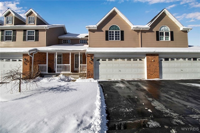 view of front of home with a garage and a porch