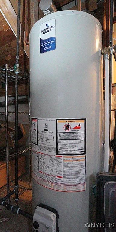 utility room with gas water heater