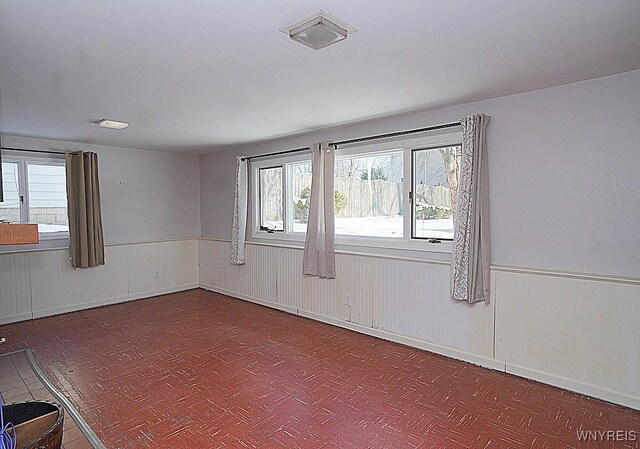 spare room featuring plenty of natural light