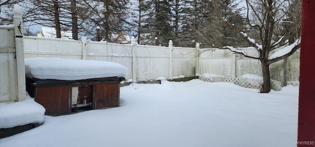 view of yard layered in snow