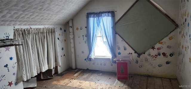 bedroom with lofted ceiling