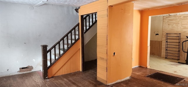 stairway featuring hardwood / wood-style floors