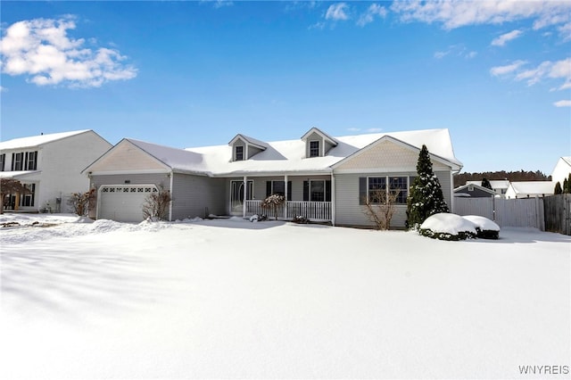 view of front of property with a garage and a porch