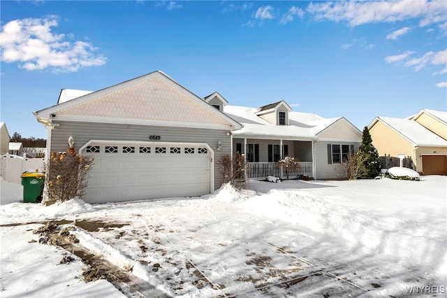 view of front of property with a garage and covered porch