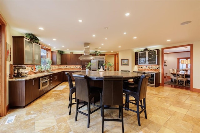 dining room featuring sink and wine cooler