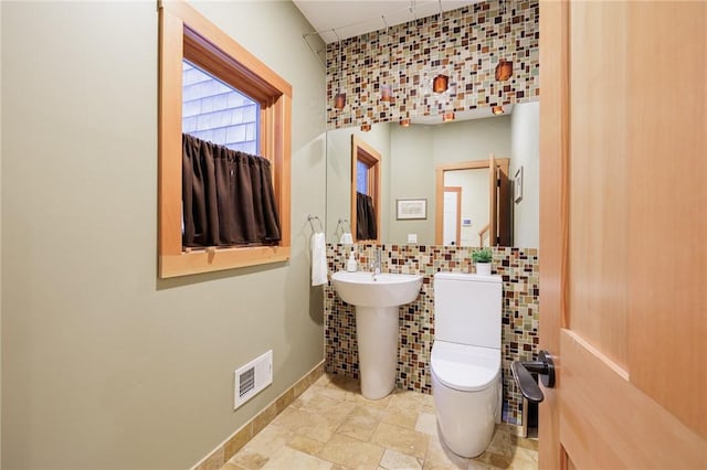 bathroom featuring sink and toilet