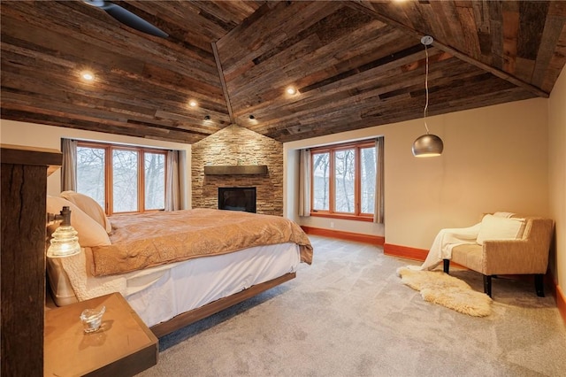 carpeted bedroom with high vaulted ceiling, a stone fireplace, and wooden ceiling