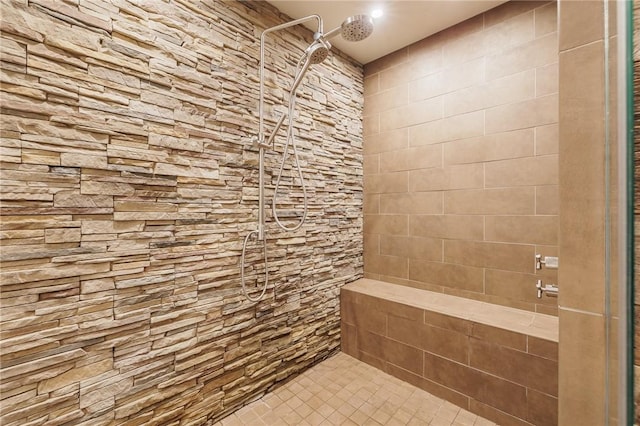 bathroom with tiled shower