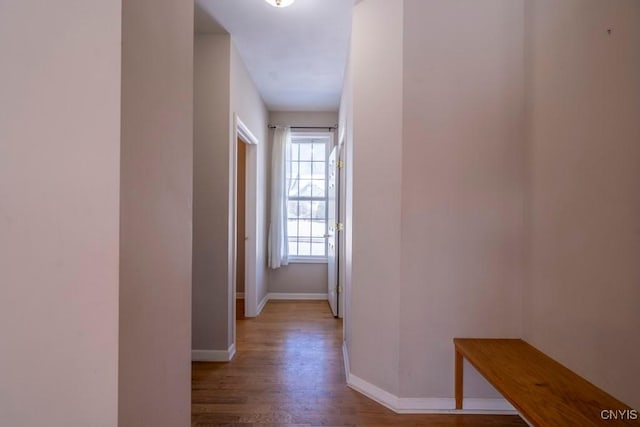 hallway with light hardwood / wood-style floors