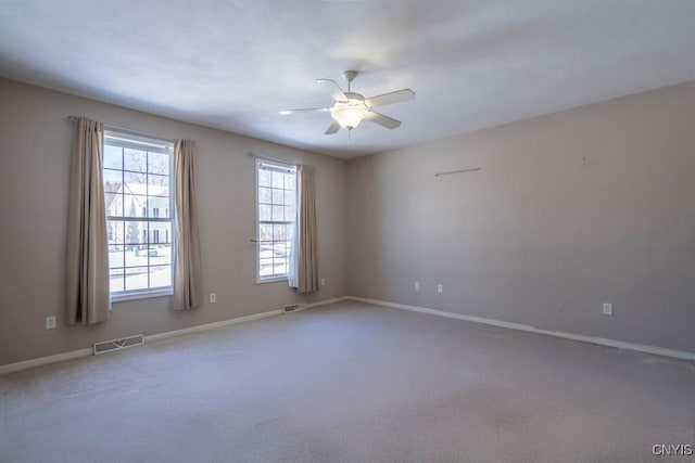 unfurnished room featuring carpet flooring and ceiling fan