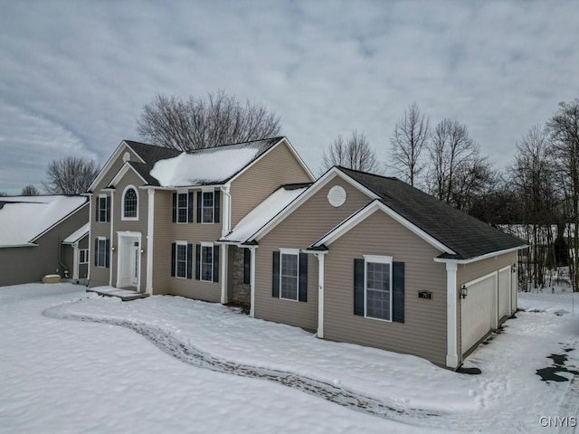 front facade with a garage