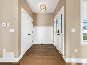 corridor with dark hardwood / wood-style floors