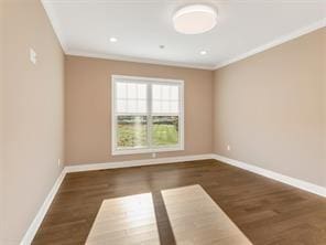 unfurnished room featuring ornamental molding and dark hardwood / wood-style floors