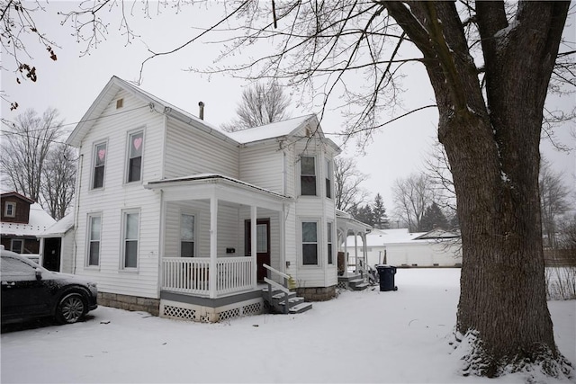 view of front of property featuring covered porch