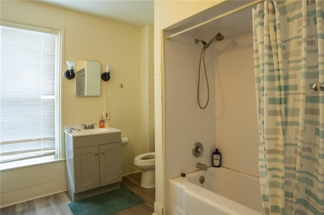 full bathroom with vanity, wood-type flooring, shower / bath combination with curtain, and toilet