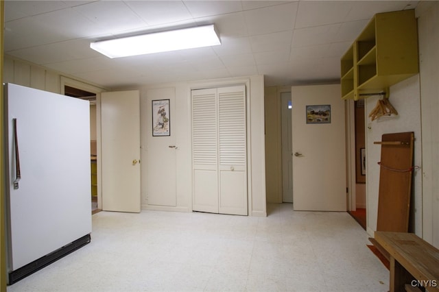 interior space with white refrigerator and a closet