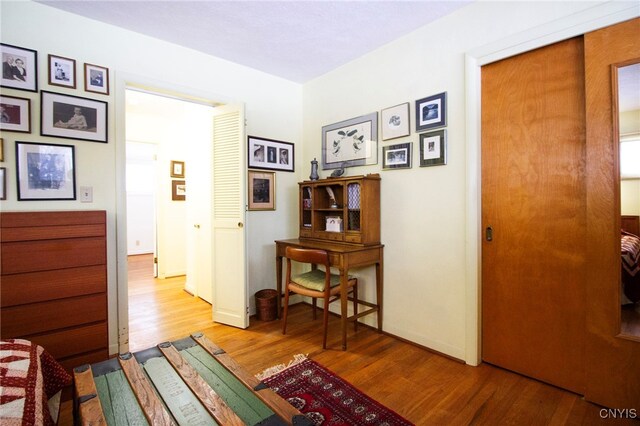 hallway with light wood-type flooring