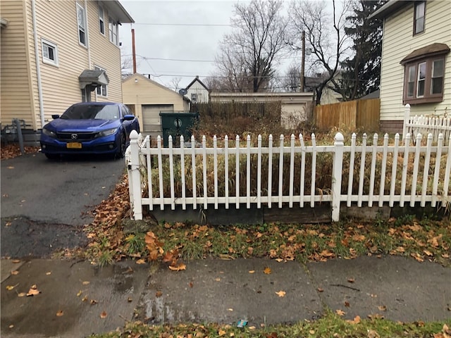 view of gate with an outdoor structure