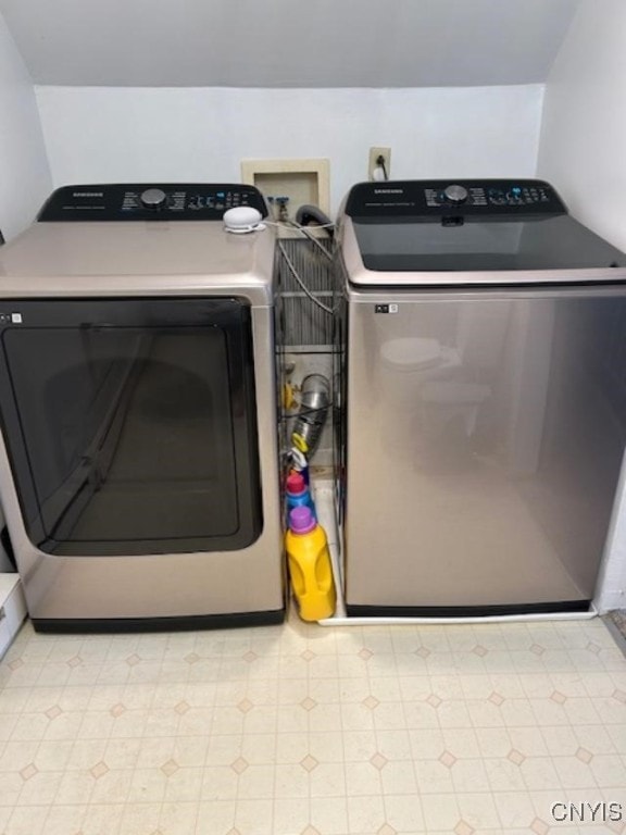 laundry area with separate washer and dryer