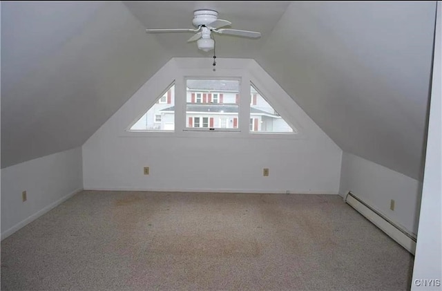 bonus room with ceiling fan, light colored carpet, vaulted ceiling, and a baseboard heating unit