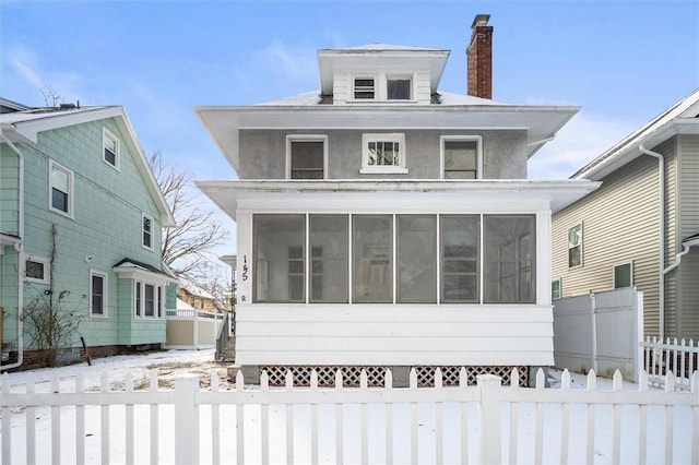 view of front of property with a sunroom