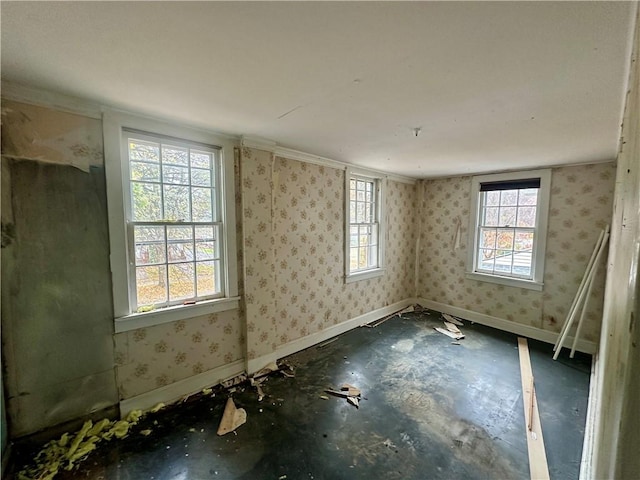 unfurnished room with crown molding