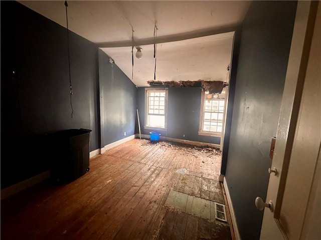 unfurnished dining area featuring hardwood / wood-style floors