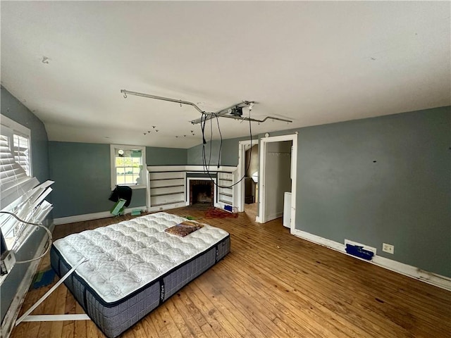 bedroom with hardwood / wood-style floors