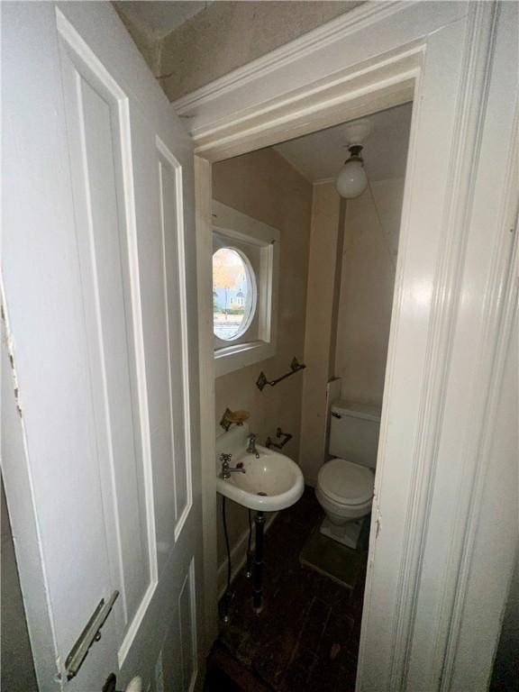 bathroom with sink and toilet