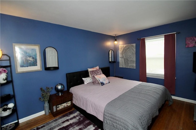 bedroom featuring dark wood-type flooring