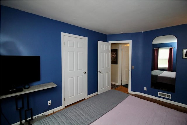 bedroom featuring hardwood / wood-style flooring