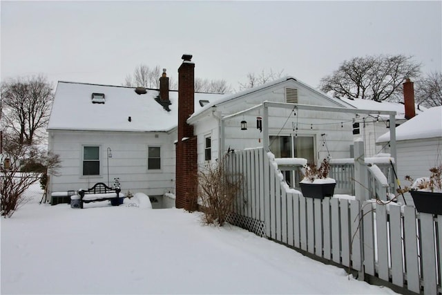 view of snow covered house