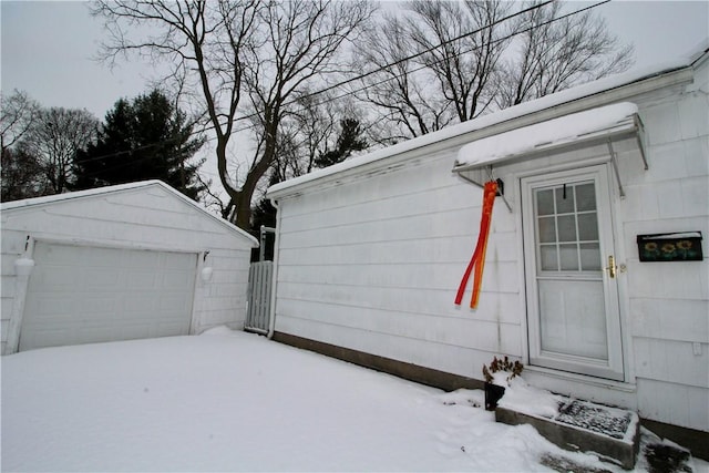 view of snow covered garage