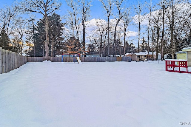 view of yard layered in snow