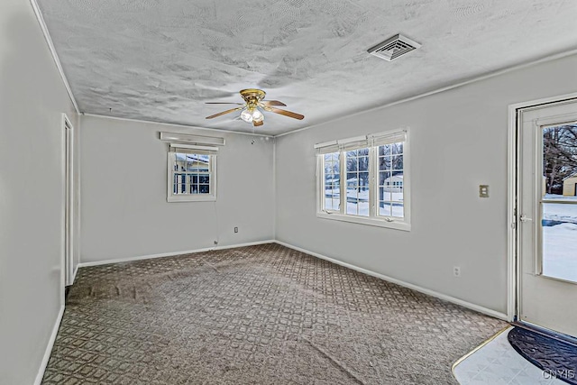 spare room with carpet floors and ceiling fan