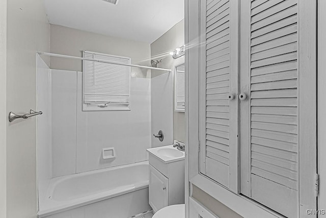 full bathroom with vanity, bathtub / shower combination, and toilet